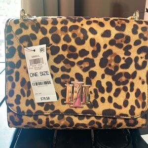 Leopard cross body !!! Nice !!! Very roomy 8 inches across 7 inches high